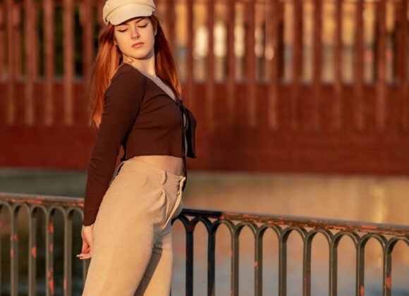 a red haired young woman in a hat posing during th 2026 01 11 09 08 44 utc scaled