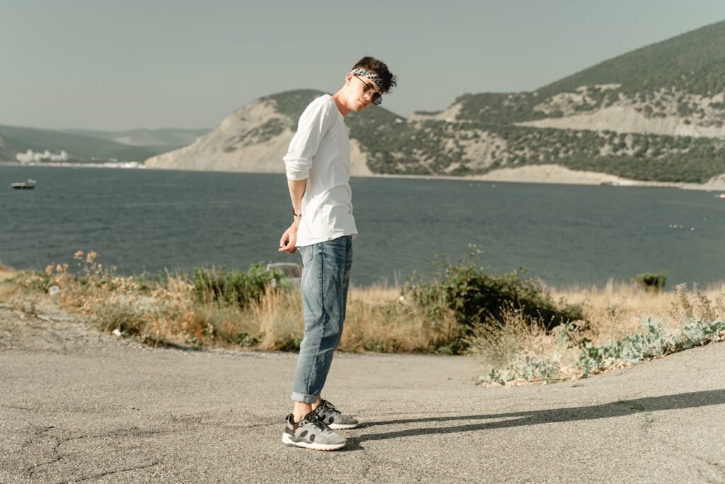 a stylish modern guy stands against the backdrop o utc