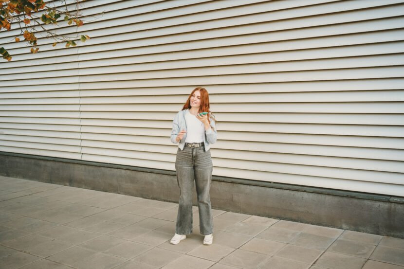 a stylish young woman confidently poses against a utc