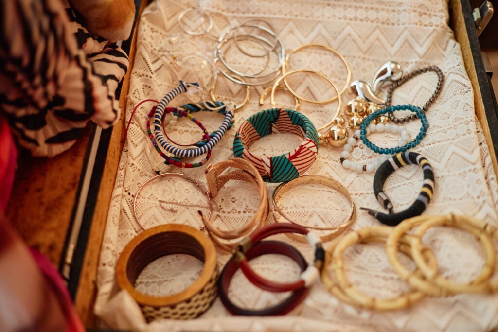 assorted second hand bracelets arranged on lace di utc