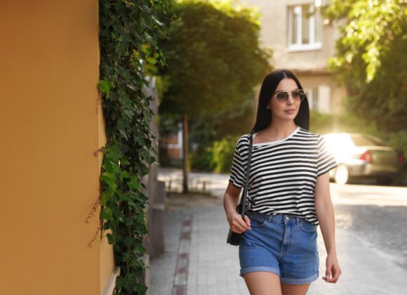 beautiful young woman in stylish sunglasses walkin 2026 01 29 19 23 06 utc scaled