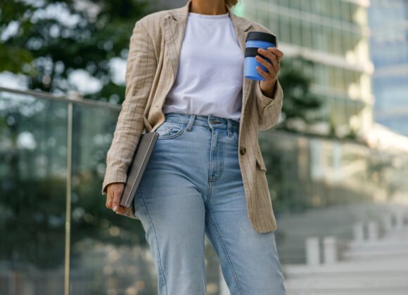 close up of female manager with laptop and take aw utc