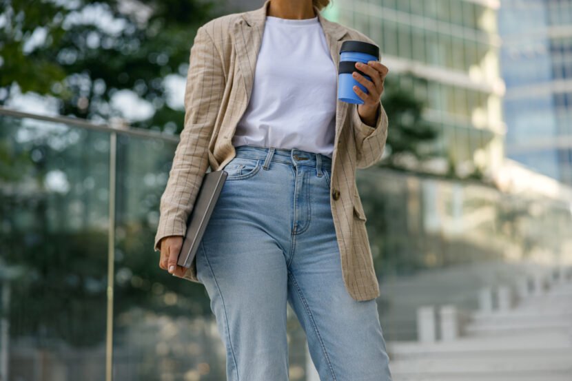 close up of female manager with laptop and take aw utc
