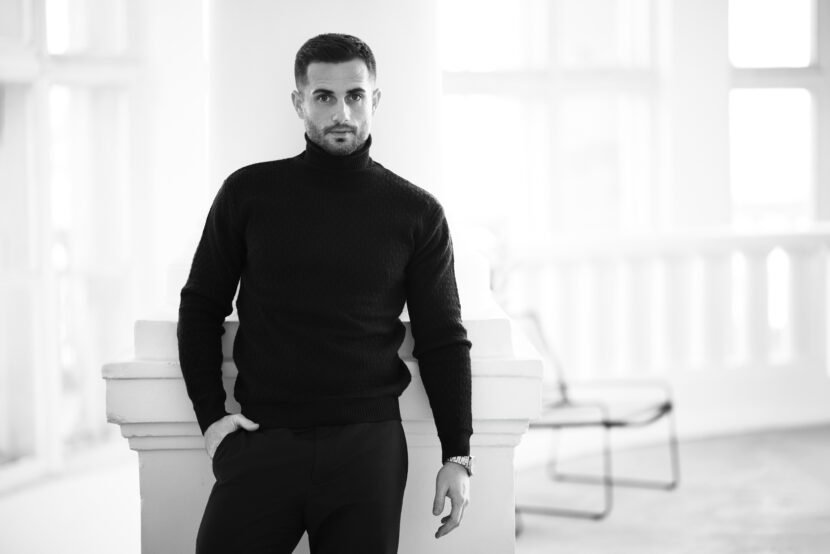 elegant man in stylish black attire with copy spac utc