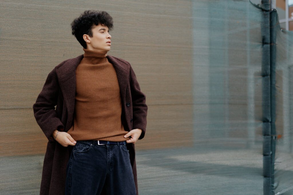 fashion man in brown turtle neck sweater and dark utc