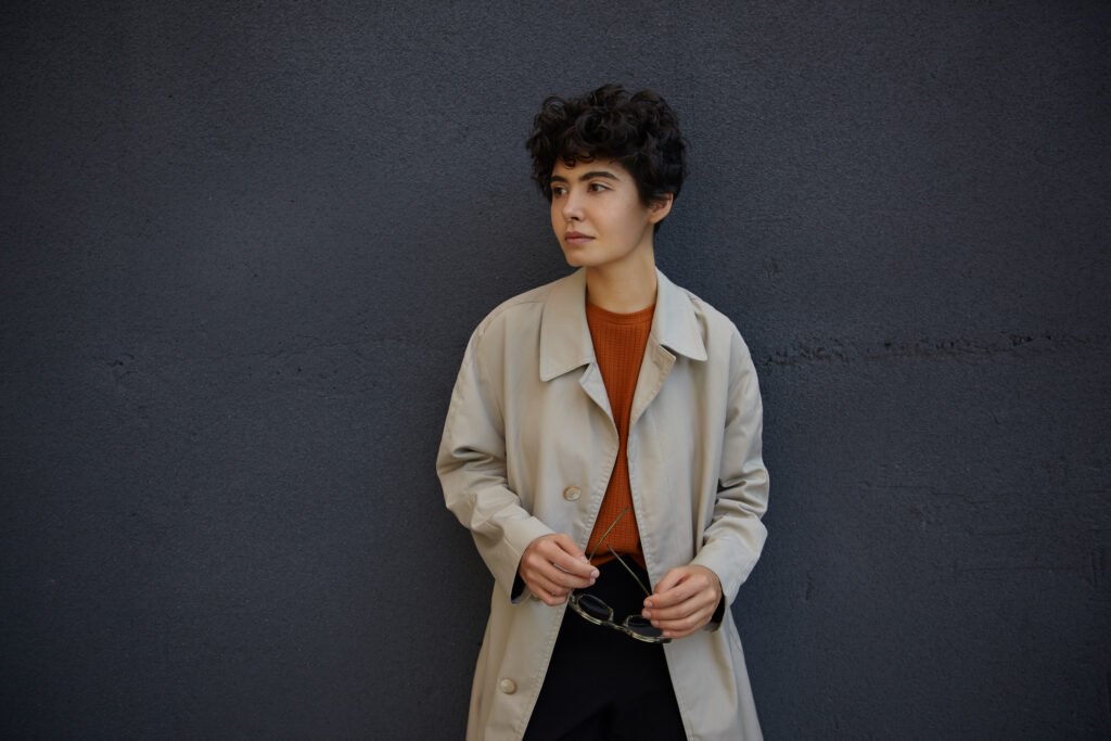 fashionable young pretty curly female with short h utc