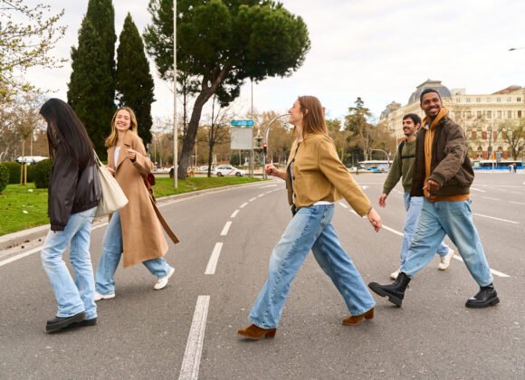 group of friends joyfully crossing a city street 2026 01 09 11 15 32 utc scaled