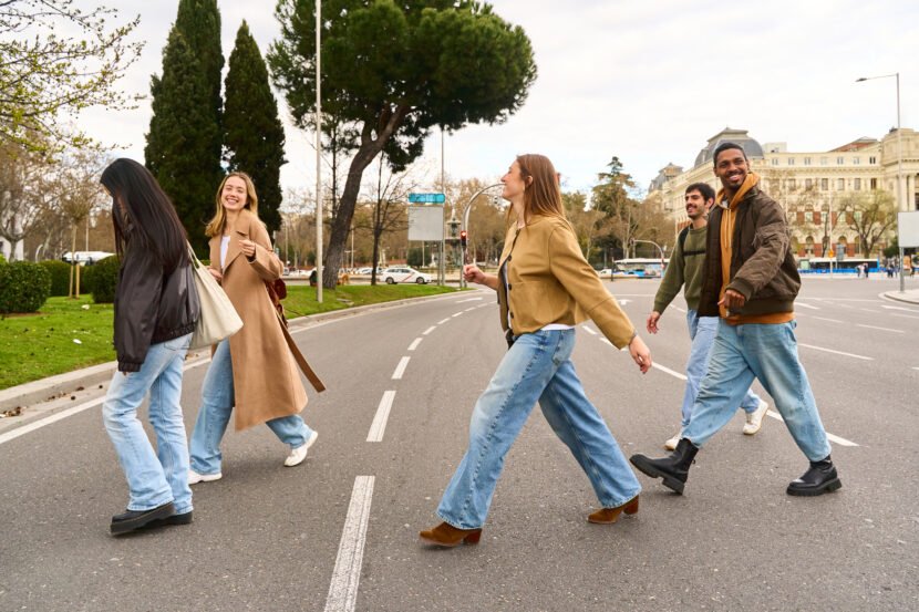 group of friends joyfully crossing a city street 2026 01 09 11 15 32 utc scaled