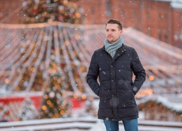happy man near fir tree branch in snow for new yea 2026 01 08 00 18 37 utc scaled