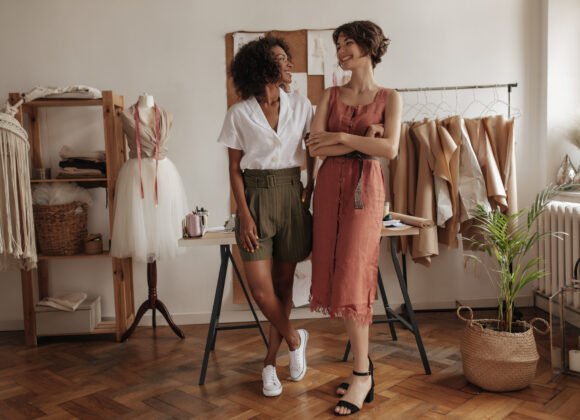 joyful young women pose in cozy office of fashion utc