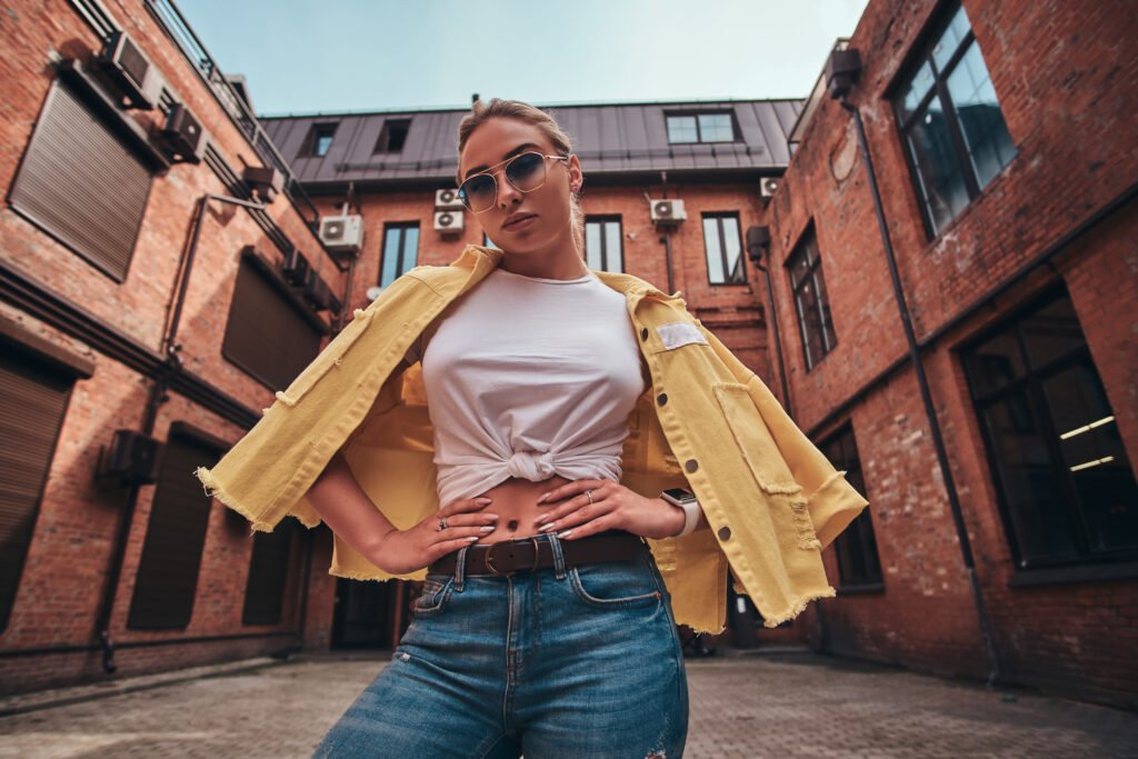 low angle photo of pretty woman in sunglasses and utc