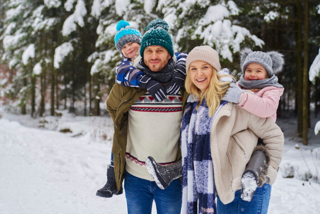 portrait of smiling family at winter day utc
