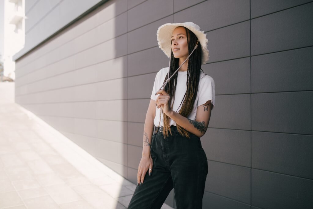 portrait of young beautiful woman with braids and utc