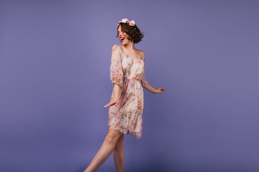 positive white lady in stylish summer dress dancin utc