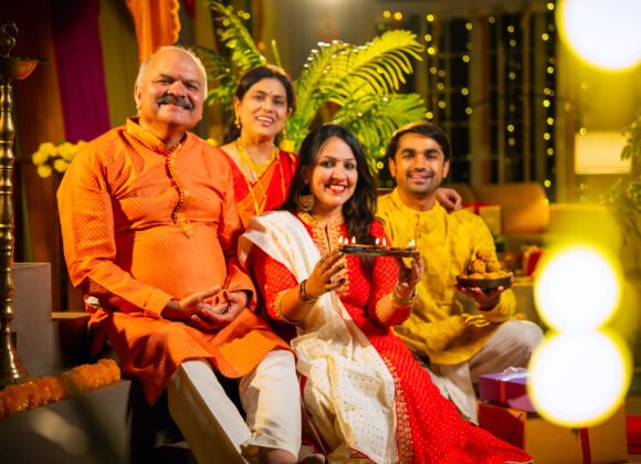 smiling indian family greets on diwali while sitti utc