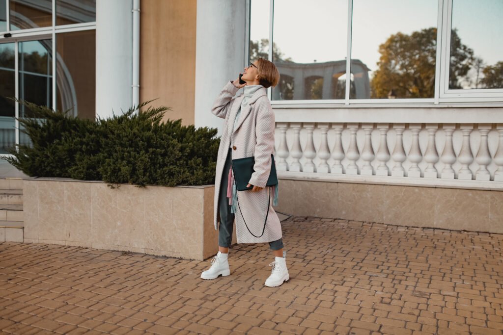stylish fashionable woman walking in street in ele utc