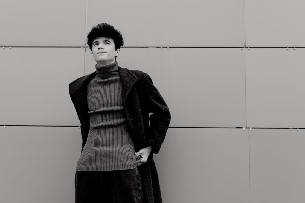 stylish young man in turtleneck sweater and coat s utc