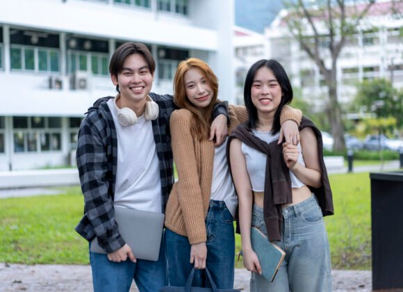 three young women are posing for a picture in fron utc