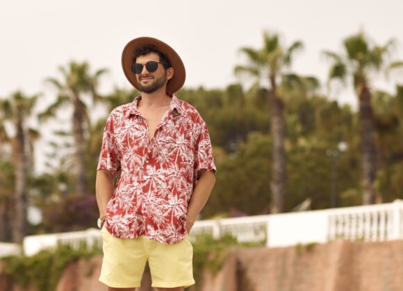 tourist beach man outdoors against palm trees on t 2026 01 08 23 00 27 utc scaled