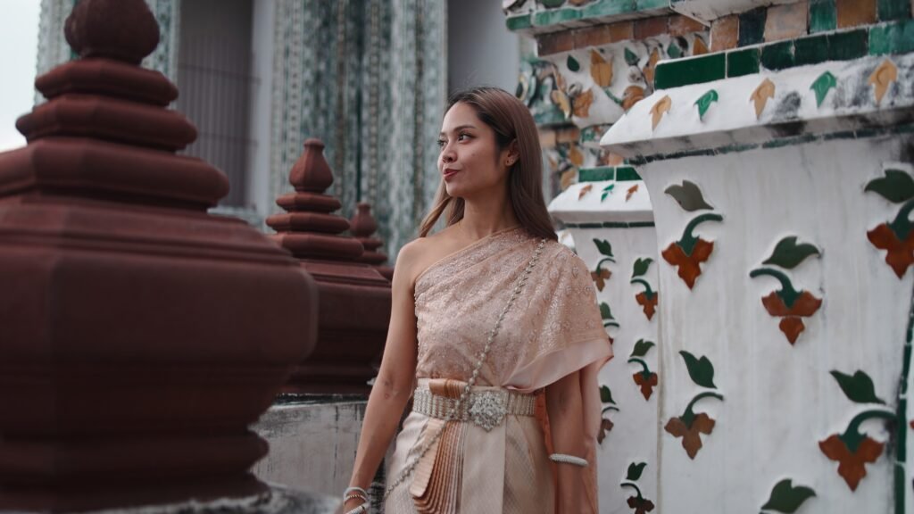 woman wearing traditional chut thai dress visiting utc