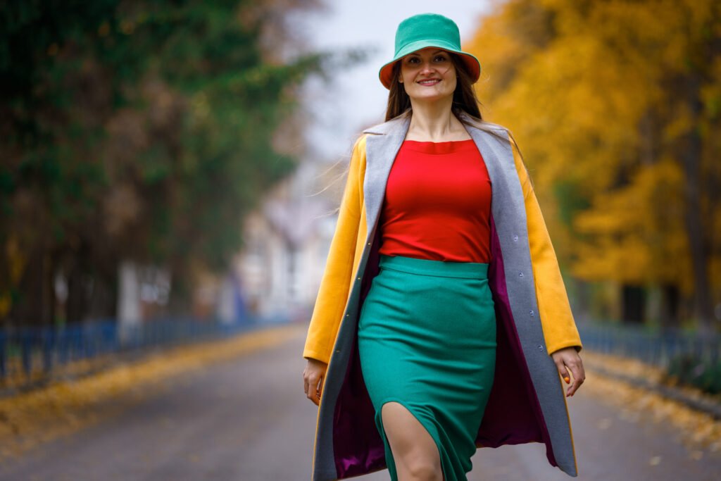 young stylish woman walking in autumn park utc