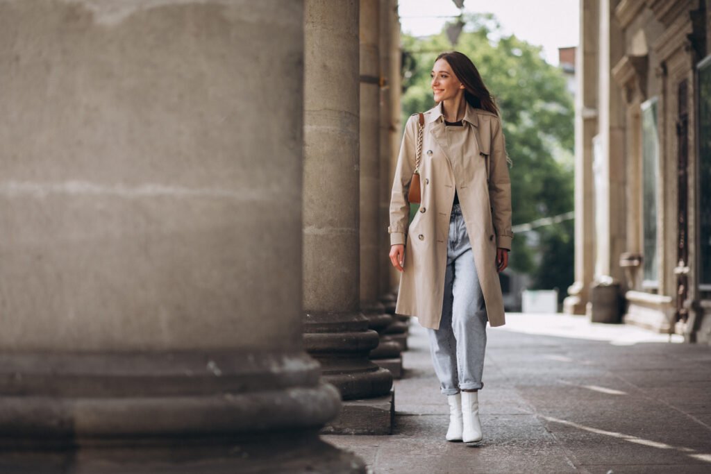 young woman student by university talking phone